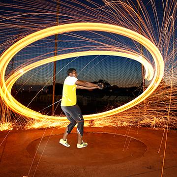 A hammer thrower winds up for a throw.